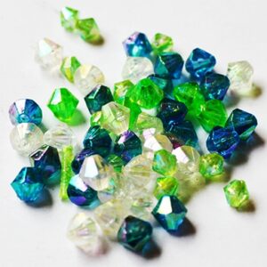 Plasthelmes romb 4-5mm, sinakasroheline/läbipaistev, ava 0.8mm, pakis 50 tk