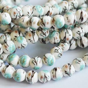 Portselanhelmes 9-8mm helesinise lillega, ava 2mm, 1 tk