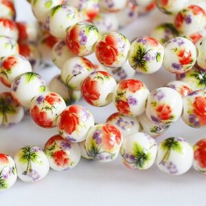 Portselanhelmes 9-8mm oranžikaspunase lillega, ava 2mm, 1 tk