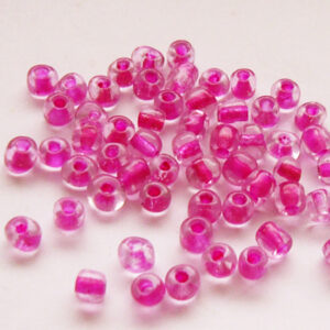 Läbipaistvad tumeroosa sisuga seemnehelmed 4mm, 10 gr.
